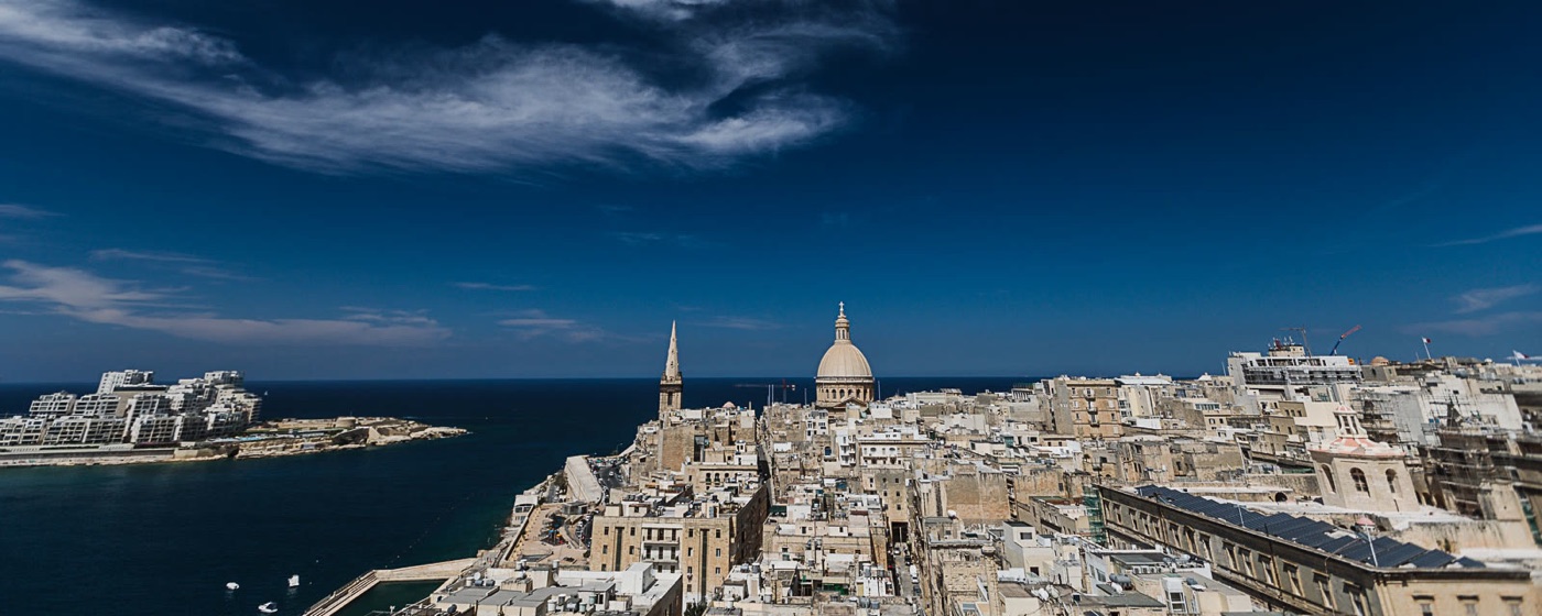 Valletta rooftops, the Carmelite dome and the sea, seen from the hotel